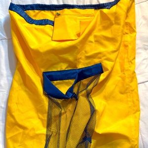 Huge laundry bag from Amazon, straps to easily carry and pockets for detergent